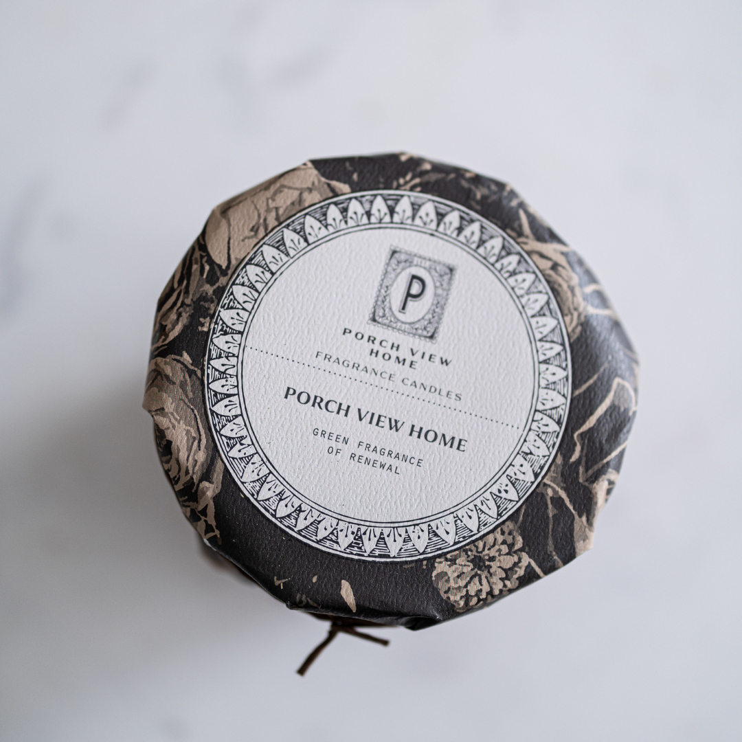 Luxe B Co porch view woven candle with a cozy design, perfect for home decor and creating a warm ambiance.