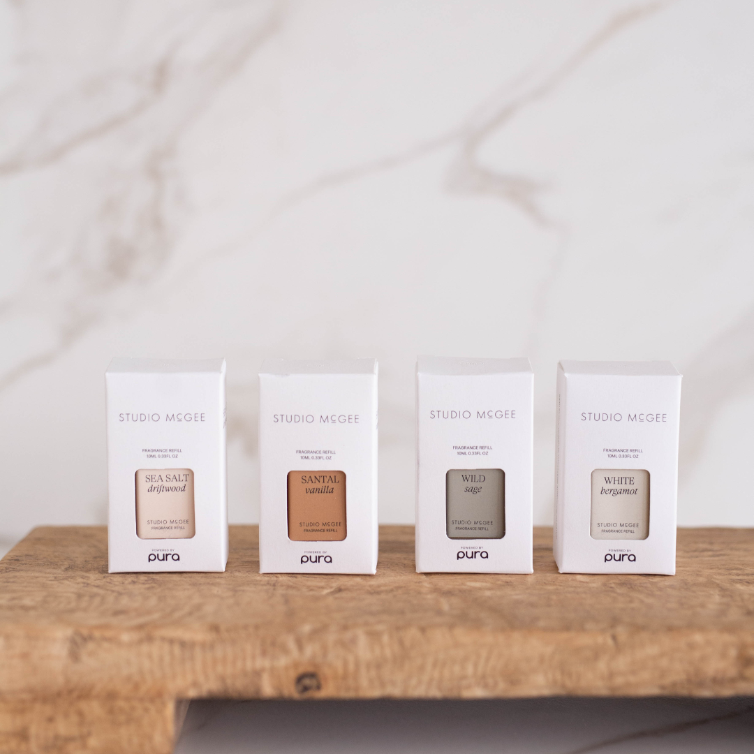 Pura x Studio McGee Santal Vanilla home fragrance refill by Luxe B Co, showing the sleek bottle and packaging design.