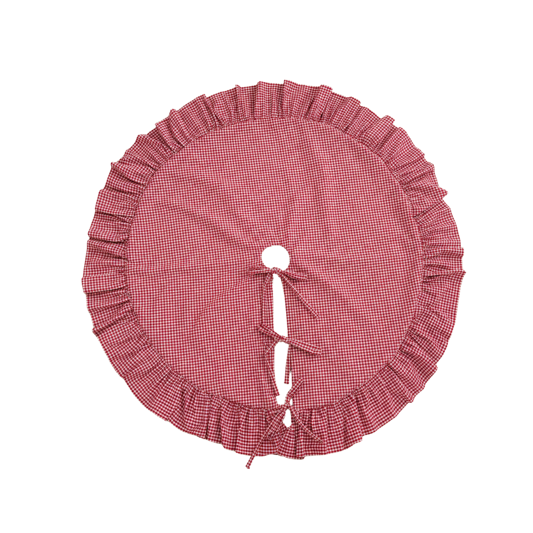 Red gingham tree skirt with ruffle trim by Luxe B Co. featuring a festive, classic design for holiday decorations.