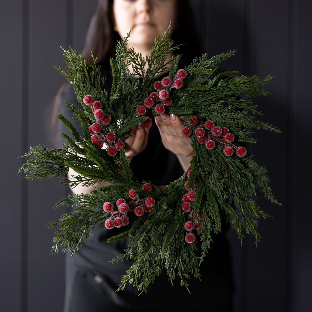 Red plum frosted berry Norfolk cypress real touch wreath, 14-inch Luxe B Co decorative wreath with vibrant red and green foliage.
