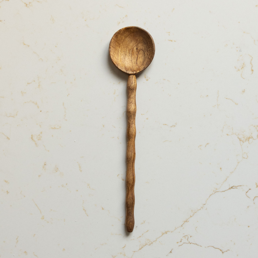 Ribbed mango wood kitchen spoon used as salad servers, crafted by Luxe B Co with natural textured design.