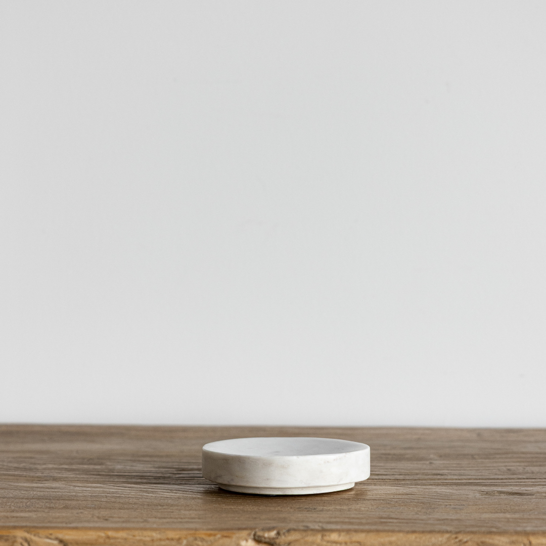 Round marble stoneware soap dish by Creative Co-op with smooth, polished surface and circular shape for bathroom or kitchen use.