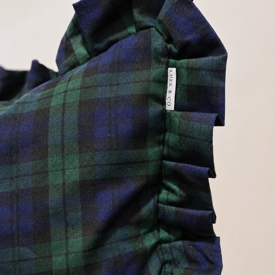 Green plaid Ruffle Bolster Pillow Cover by Luxe B Co with ruffled edges for a cozy, decorative accent.