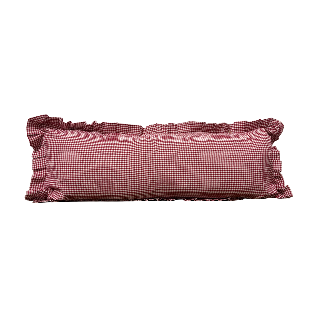 Red gingham ruffle bolster pillow cover by Luxe B Co featuring a charming, decorative ruffle design.