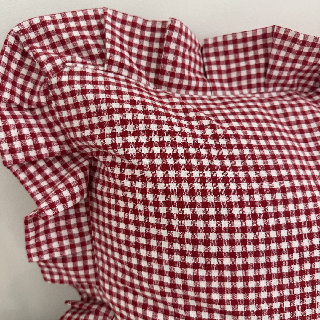 Red gingham lumbar pillow sham with ruffle detail from Luxe B Co, showcasing a cozy, decorative pillow cover.