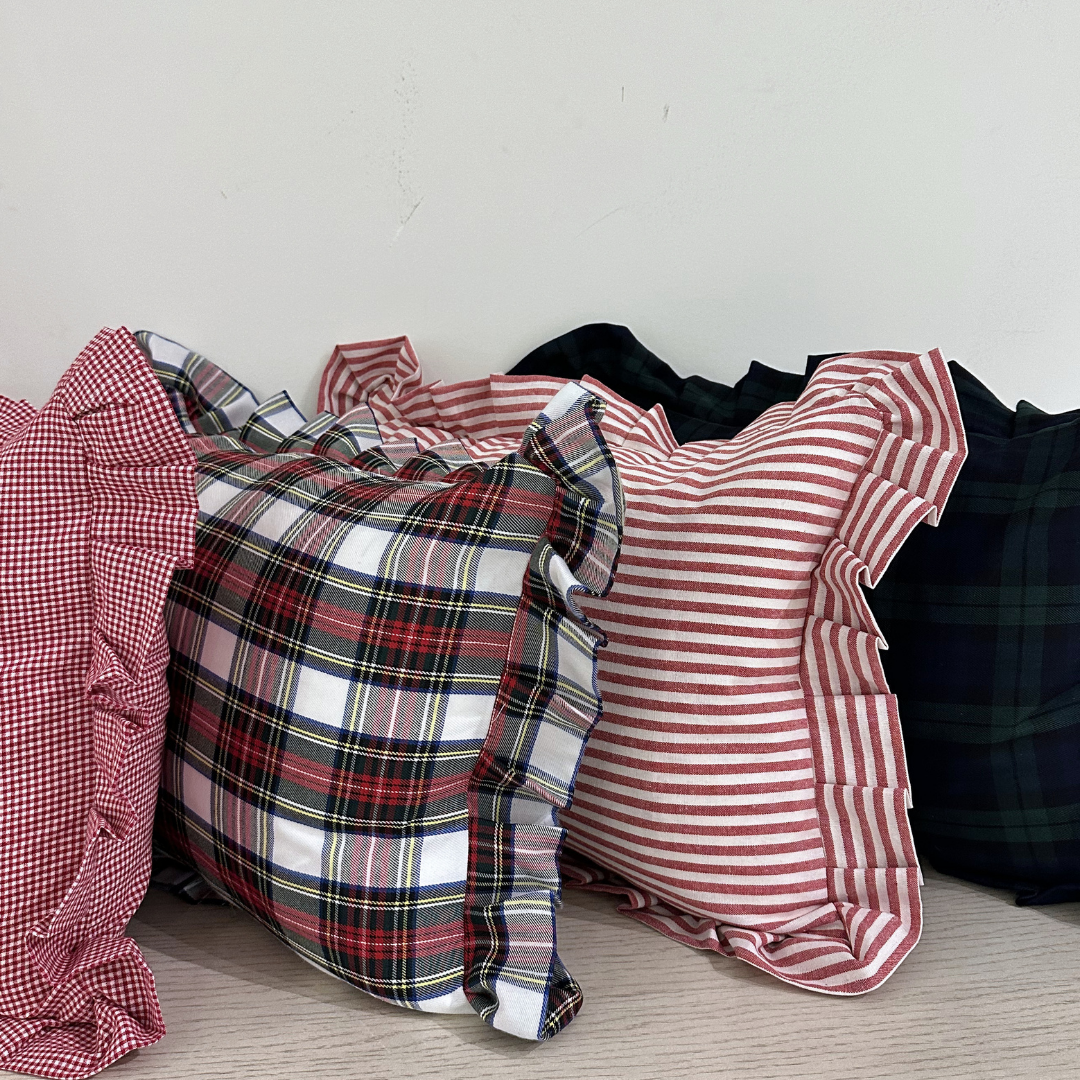 Red striped ruffle lumbar pillow sham by Luxe B Co, showcasing soft fabric and decorative ruffle detailing.