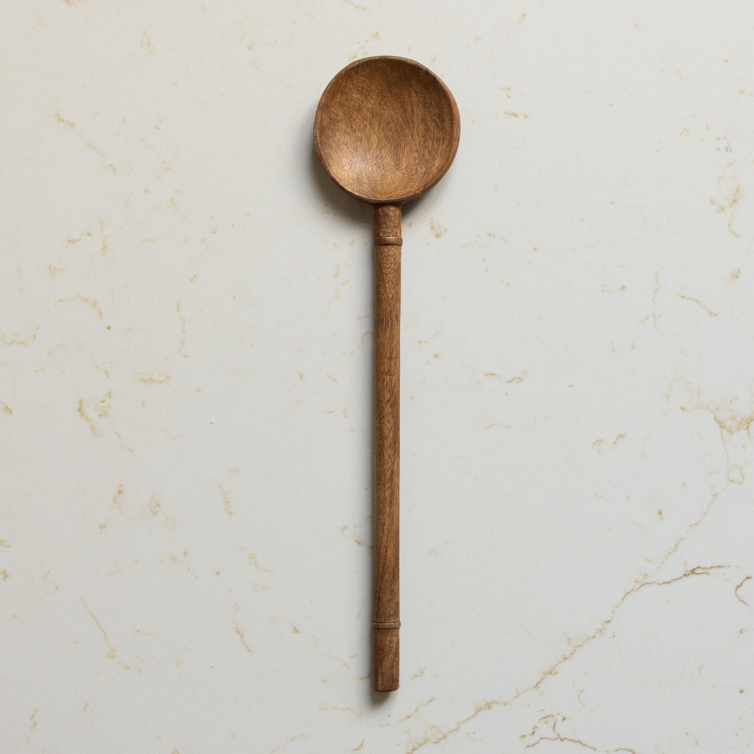 Smooth mango wood kitchen spoon used as salad servers, crafted by Luxe B Co, with a natural polished finish.