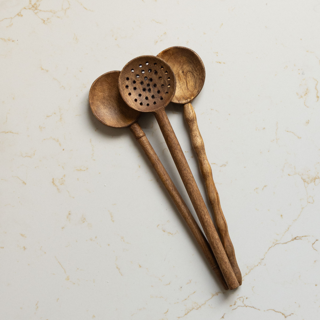 Smooth mango wood kitchen spoon from Luxe B Co, used as salad servers, with a sleek, polished finish and ergonomic handle.