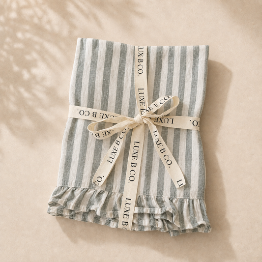 Soft green linen dish towel with ruffle details from Luxe B Co, perfect for kitchen decor and everyday use.