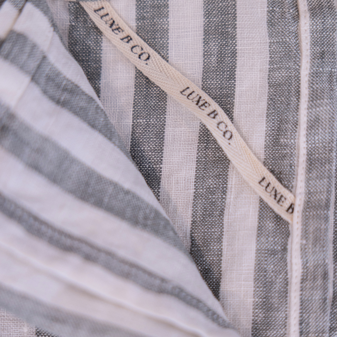 Soft green stripe linen dish towel set by Luxe B Co, featuring elegant fabric and classic design for kitchen use.