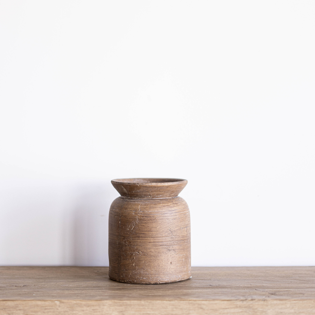 Terracotta brown etched vase by PD HOME with intricate carved patterns, ideal for decorative floral arrangements.