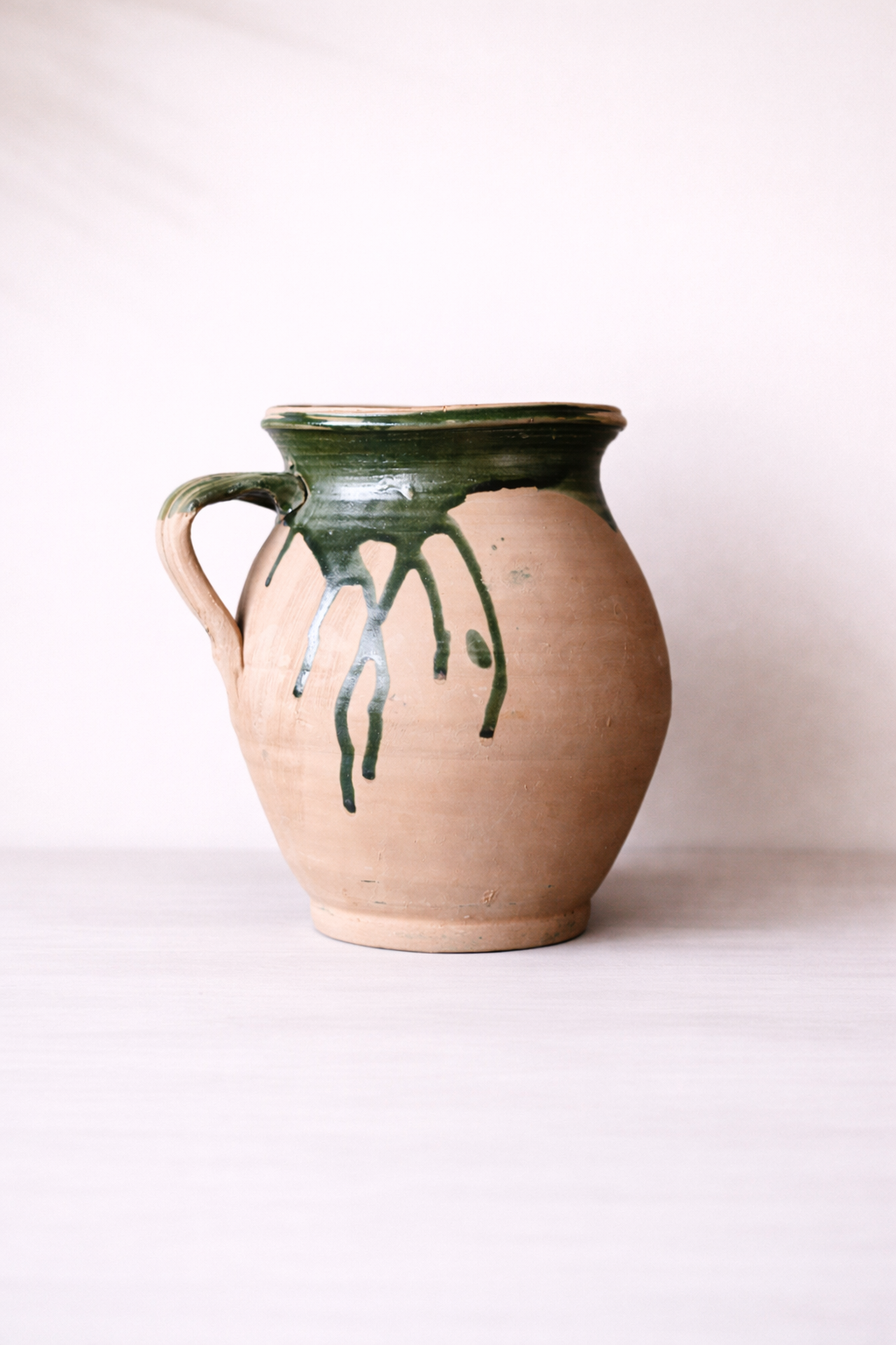 Terracotta green drip replica vase by Luxe B Co, unique one-of-a-kind ceramic with textured drip design and earthy tones.