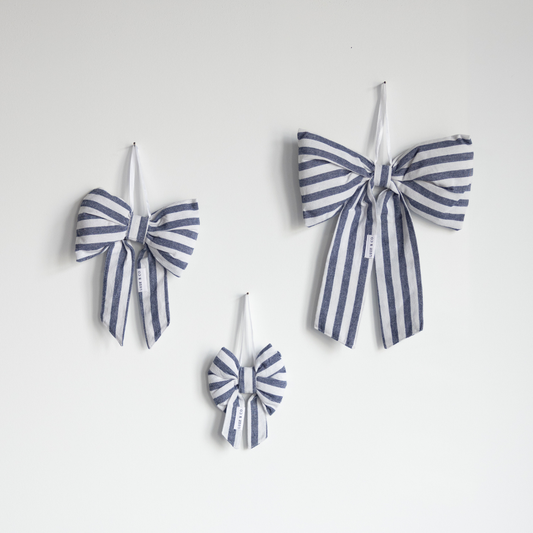 Blue fabric bows with striped pattern, Luxe B Co, featuring elegant, handmade bows suitable for gift wrapping or decoration.