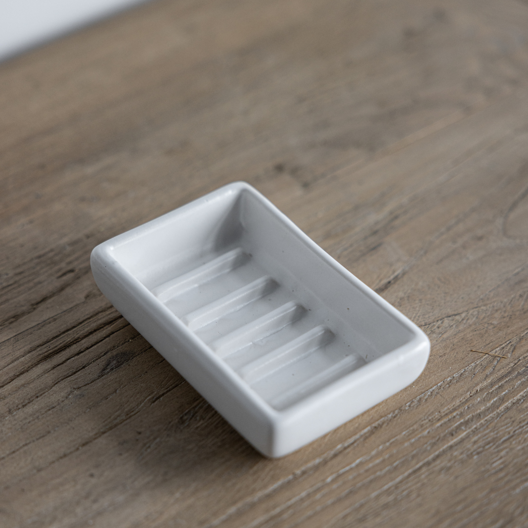 White Luna ceramic soap dish by Luxe B Co, featuring a sleek, minimalist design with smooth white finish for bathroom decor.