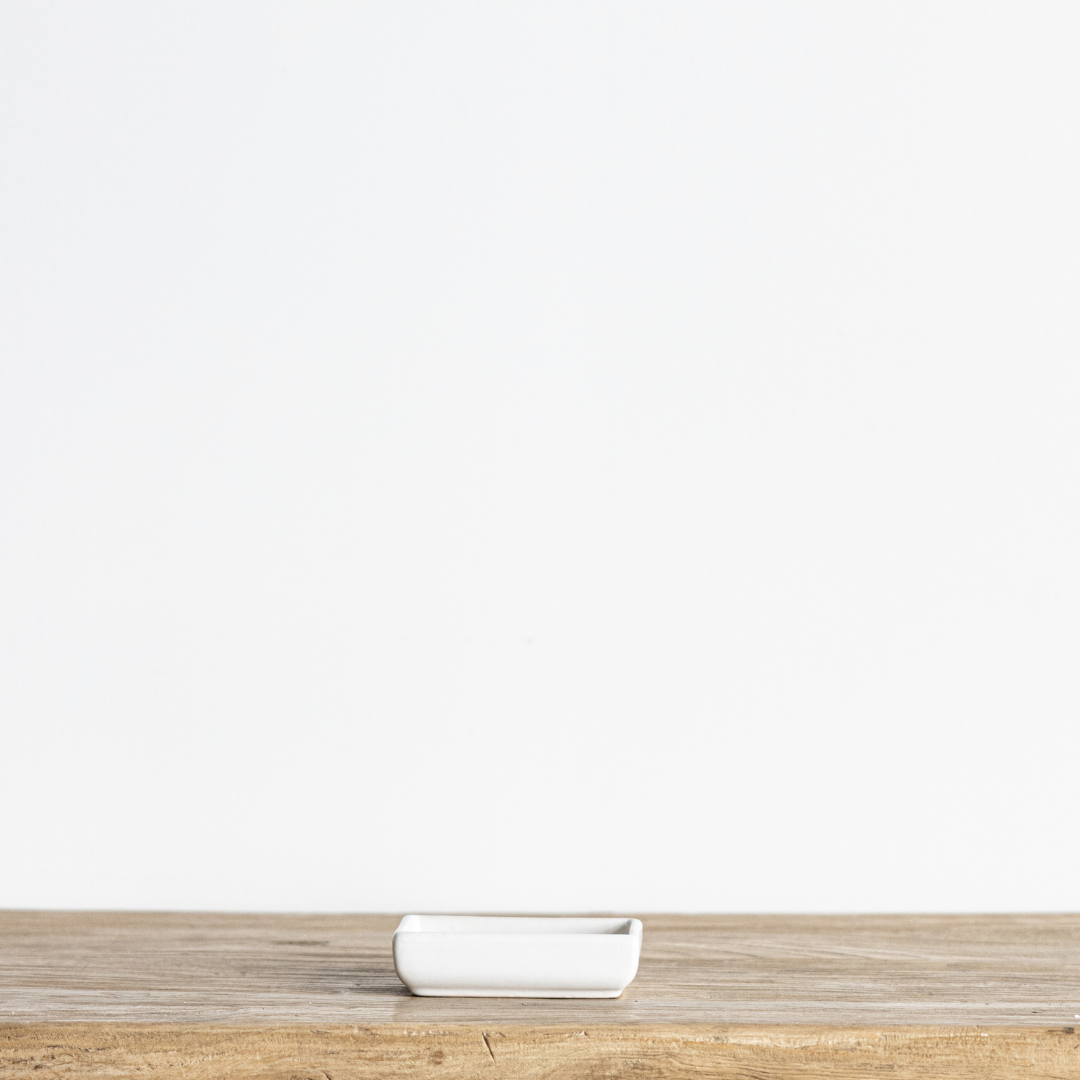 White Luna ceramic soap dish by Luxe B Co, round-shaped with a smooth glossy finish, perfect for bathroom or kitchen use.