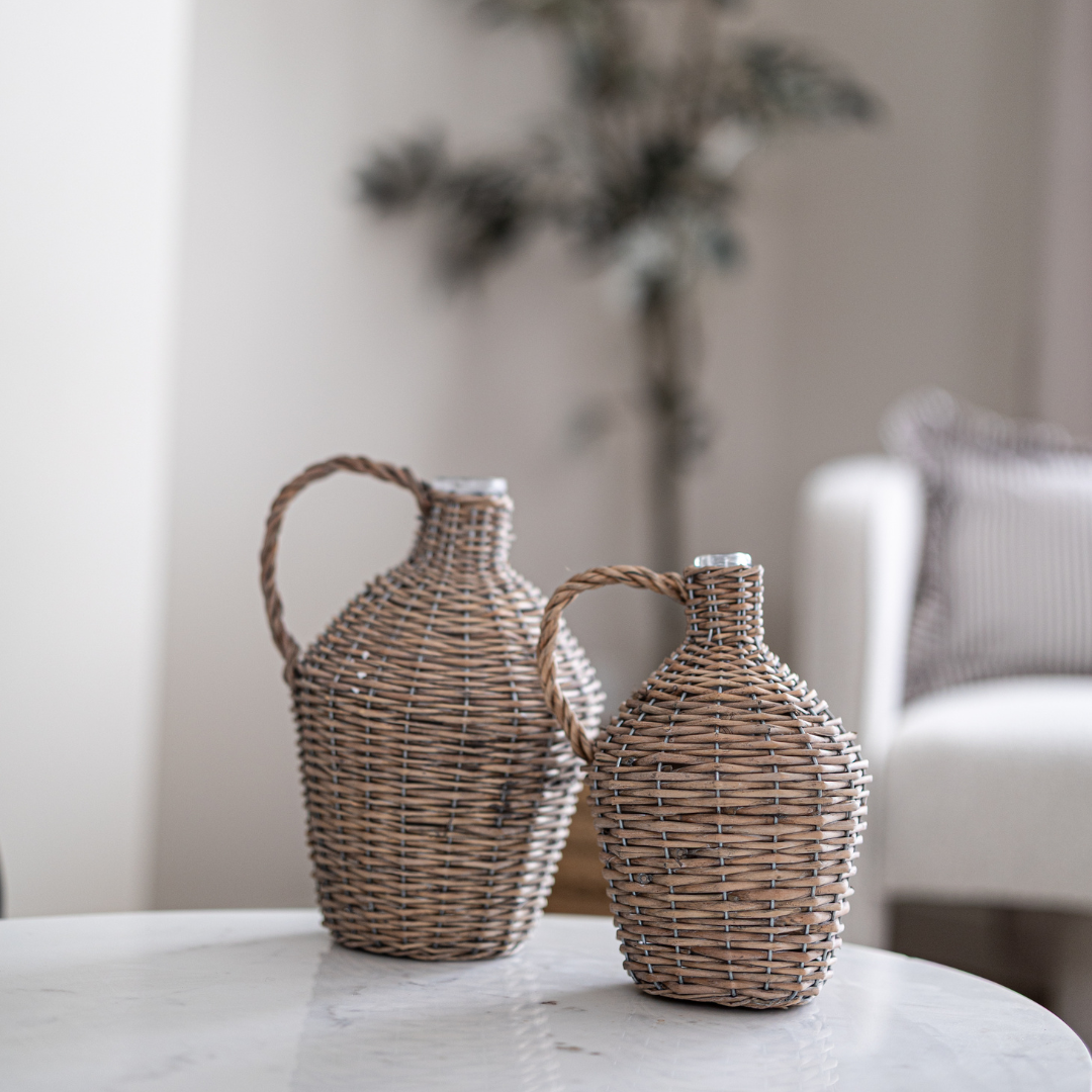 Decorative willow-wrapped wine bottle jug by Porch View Home, featuring natural woven willow accents on a glass bottle.