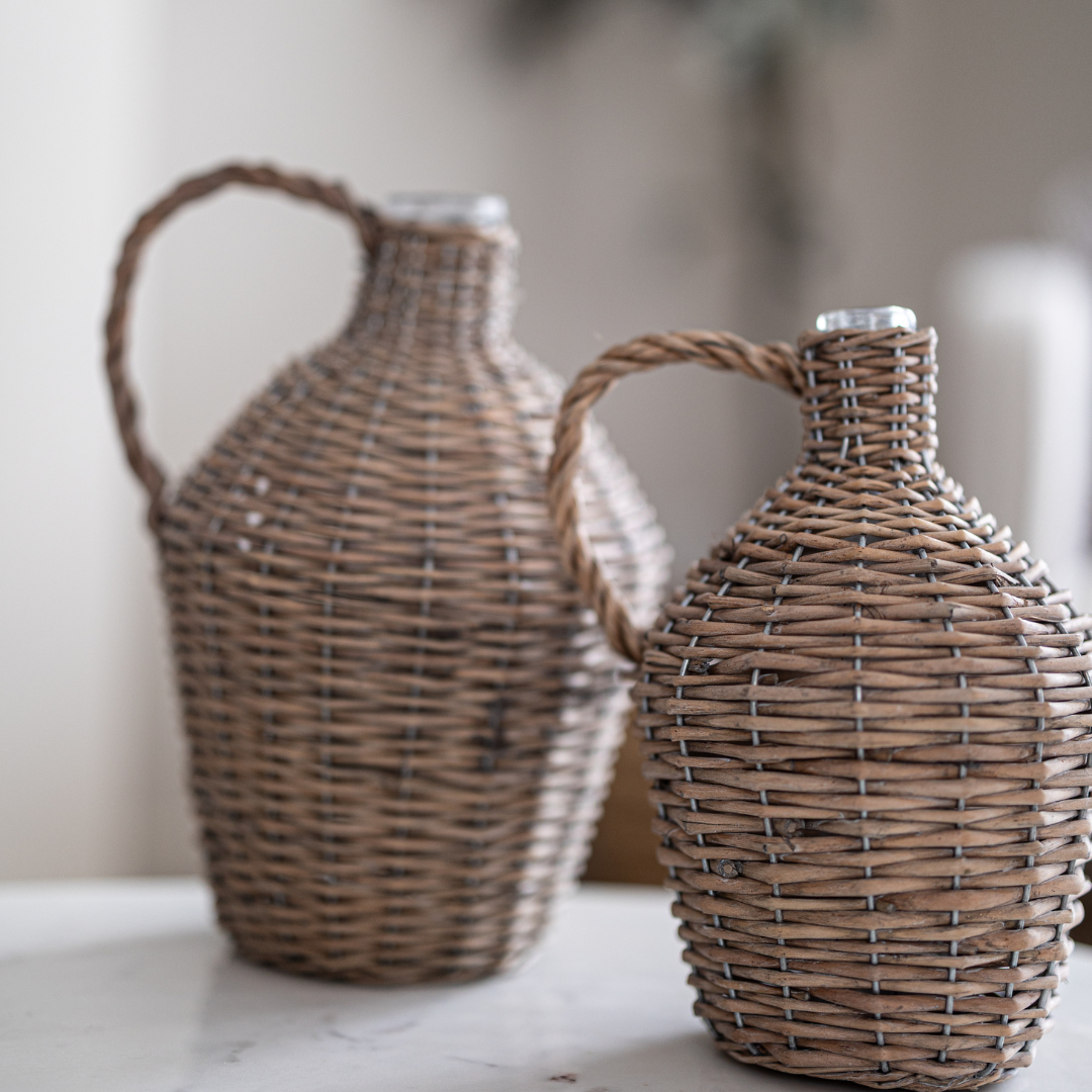 Decorative willow-wrapped wine bottle jug by Porch View Home, featuring natural woven design and rustic charm.