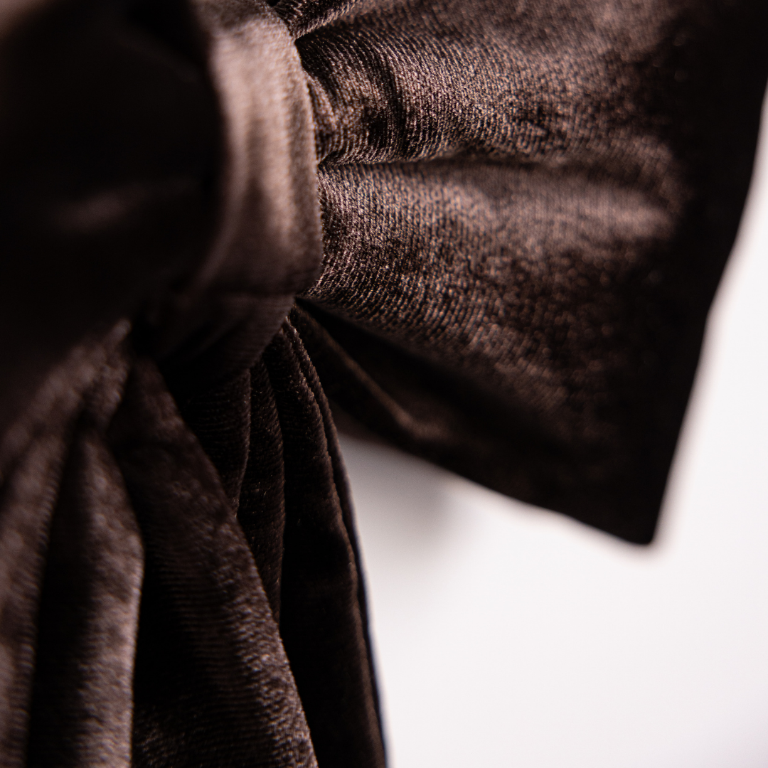 Close-up of Luxe B Co brown velvet fabric bows showcasing soft texture and elegant design for accessories or decoration.