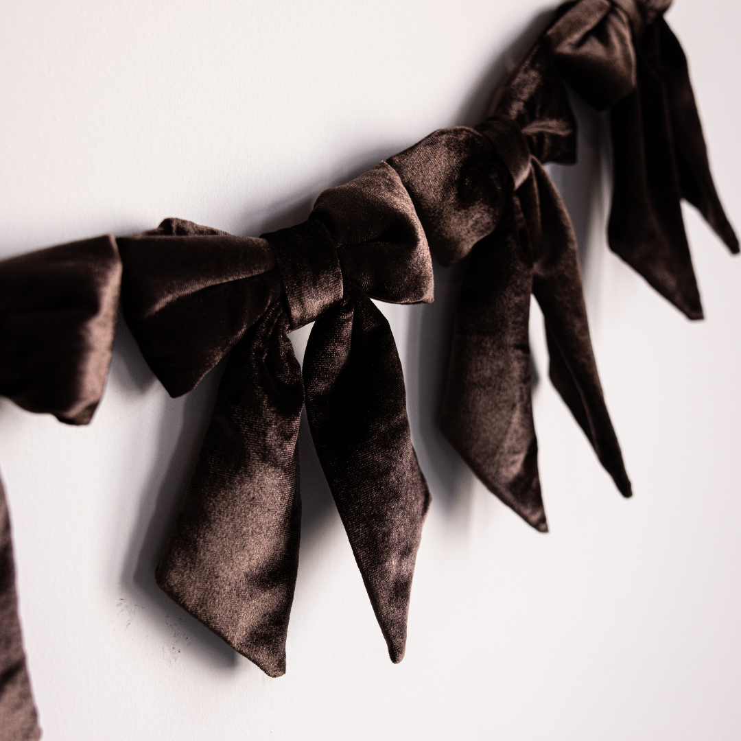 Set of brown velvet fabric bow garlands by Luxe B Co, featuring mini holiday bows for Christmas decor and festive decorations.